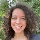 Woman with brown curly hair